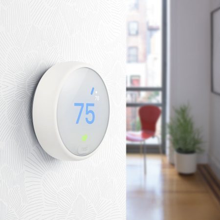 Nest Learning Thermostat on wall